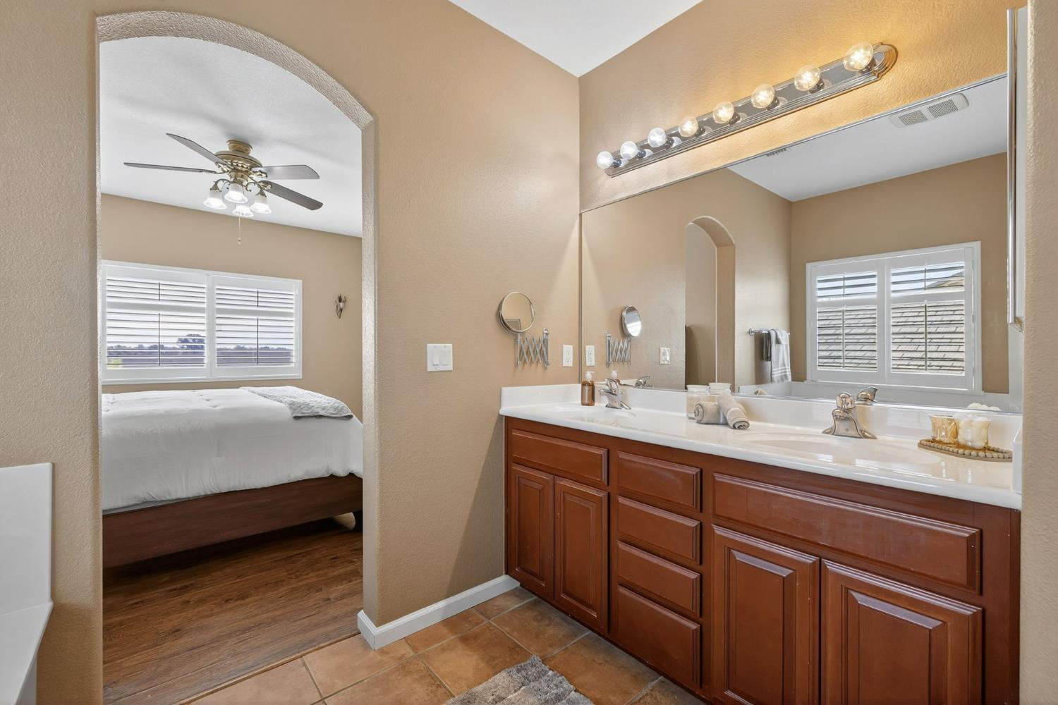 1716 Presidio Way Plumas Lake, CA 95961 - Photo 35 of 43 a en suite bathroom with a double vanity sink and a mirror