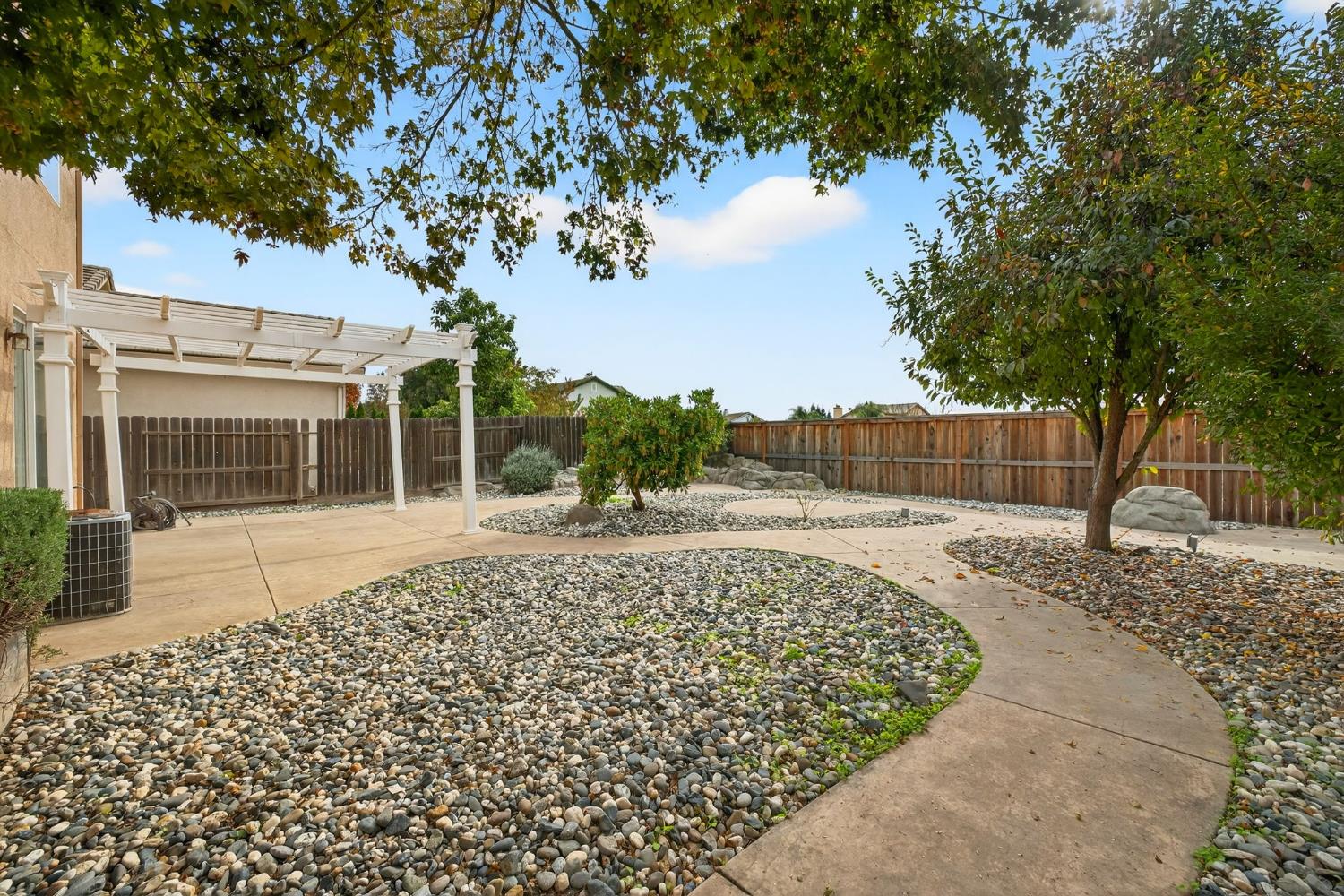 1716 Presidio Way Plumas Lake, CA 95961 - Photo 39 of 43 a view of a yard with plants and trees