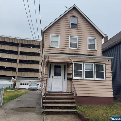 a front view of a house with a garage