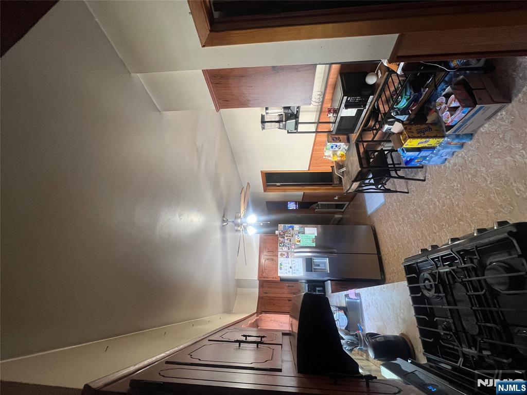 68 Atlantic Street Carteret, NJ 07008 - Photo 25 of 38 a kitchen with furniture and a stove