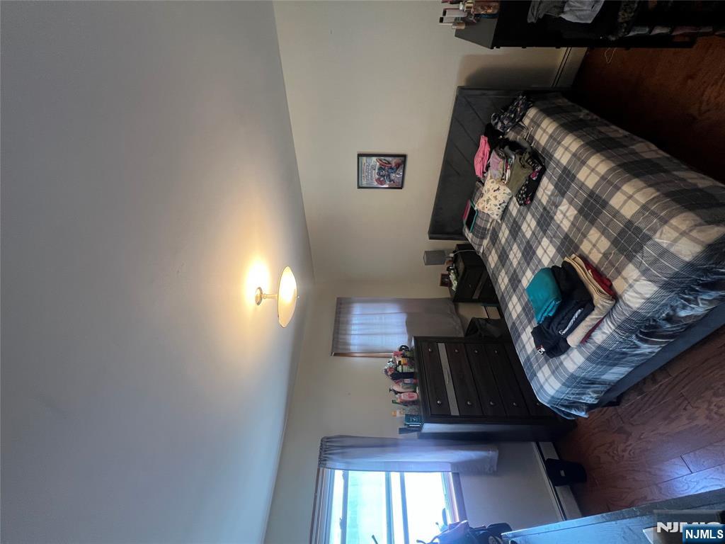 68 Atlantic Street Carteret, NJ 07008 - Photo 26 of 38 a bedroom with a bed and window