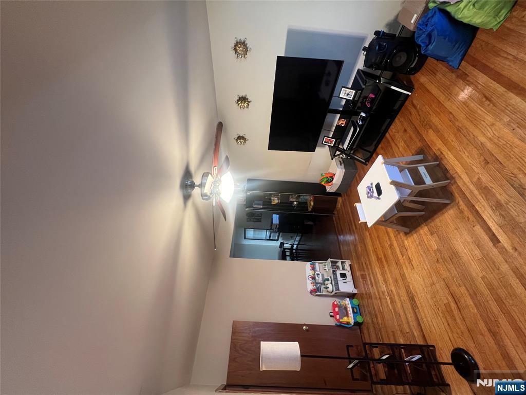 68 Atlantic Street Carteret, NJ 07008 - Photo 27 of 38 a living room with furniture and a flat screen tv