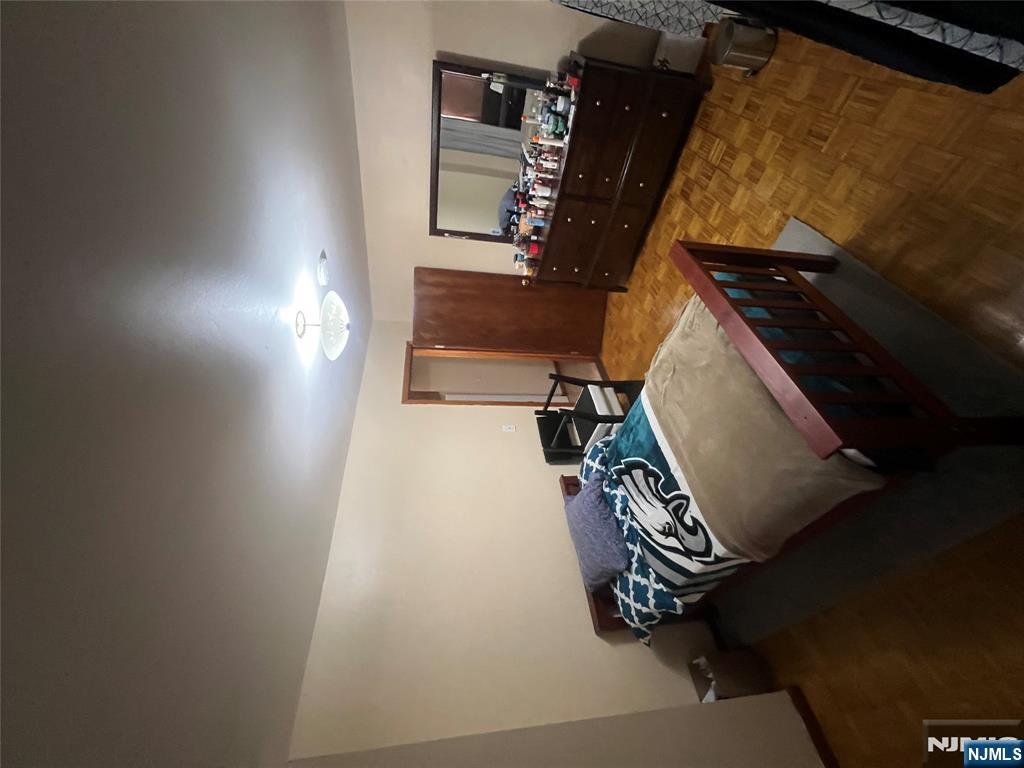 68 Atlantic Street Carteret, NJ 07008 - Photo 28 of 38 a bed sitting in a bedroom next to a larger window