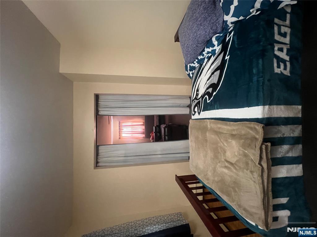 68 Atlantic Street Carteret, NJ 07008 - Photo 29 of 38 a bedroom with a bed and a window