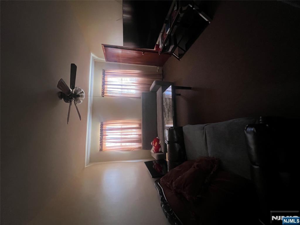 68 Atlantic Street Carteret, NJ 07008 - Photo 30 of 38 a room with pool table flat screen tv and windows