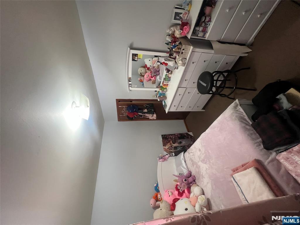 68 Atlantic Street Carteret, NJ 07008 - Photo 34 of 38 a bedroom with a bed and furniture