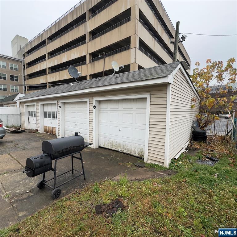 68 Atlantic Street Carteret, NJ 07008 - Photo 7 of 38 a backyard of a house with table and chairs