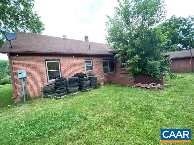 592 Middlebrook Road Staunton, VA 24401 - Photo 14 of 15 a backyard of a house with table and chairs