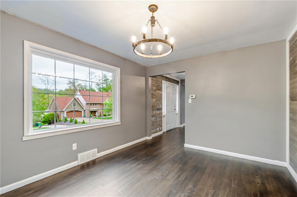 1611 Branning Road Pittsburgh, PA 15235 - Photo 20 of 38 a view of an empty room with wooden floor and a window