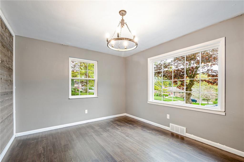 1611 Branning Road Pittsburgh, PA 15235 - Photo 22 of 38 a view of an empty room with wooden floor and a window