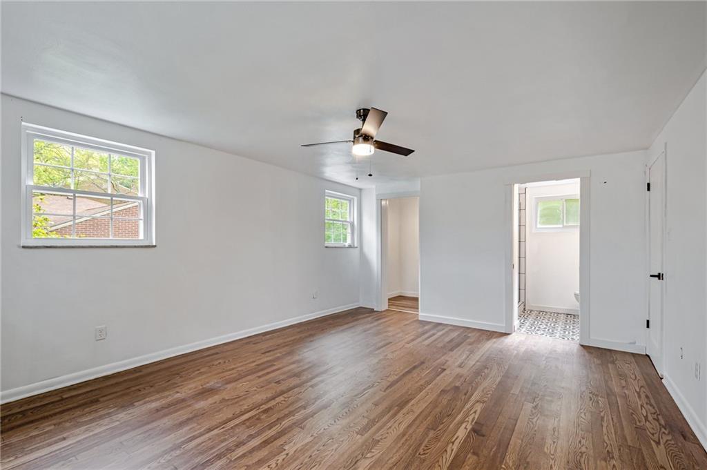 1611 Branning Road Pittsburgh, PA 15235 - Photo 25 of 38 a view of an empty room with wooden floor and a window