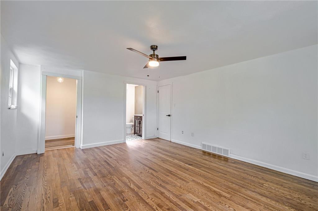 1611 Branning Road Pittsburgh, PA 15235 - Photo 26 of 38 a view of an empty room with wooden floor