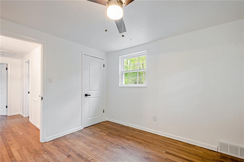 1611 Branning Road Pittsburgh, PA 15235 - Photo 31 of 38 a view of an empty room with wooden floor and a window