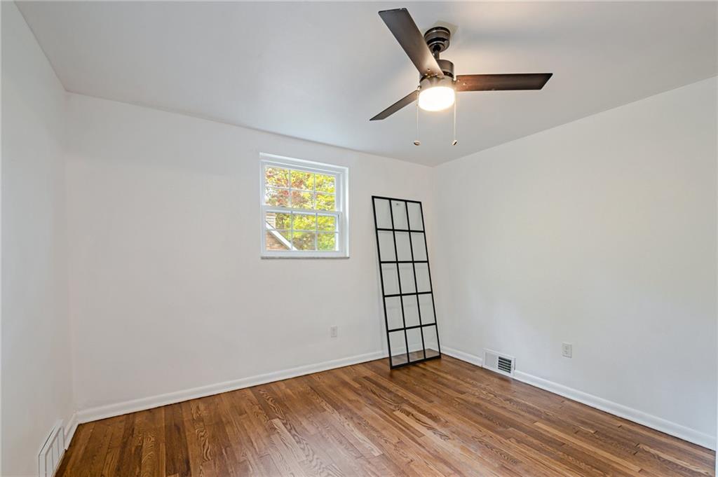 1611 Branning Road Pittsburgh, PA 15235 - Photo 32 of 38 an empty room with windows and fan