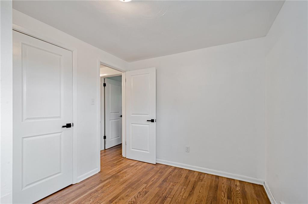 1611 Branning Road Pittsburgh, PA 15235 - Photo 34 of 38 a view of an empty room with wooden floor