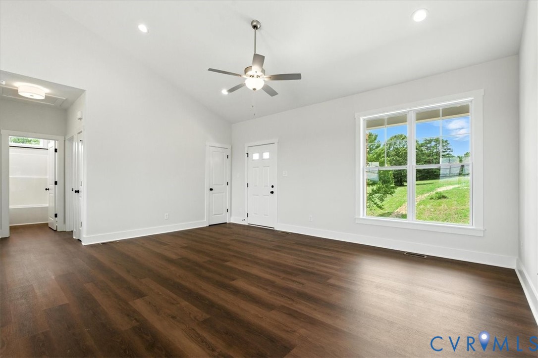 8666 Hat Creek Road Brookneal, VA 24528 - Photo 14 of 38 an empty room with wooden floor and windows