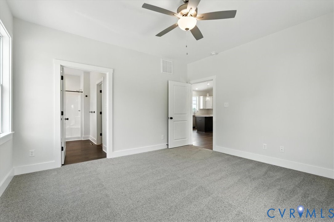 8666 Hat Creek Road Brookneal, VA 24528 - Photo 34 of 38 a view of an empty room with a ceiling fan