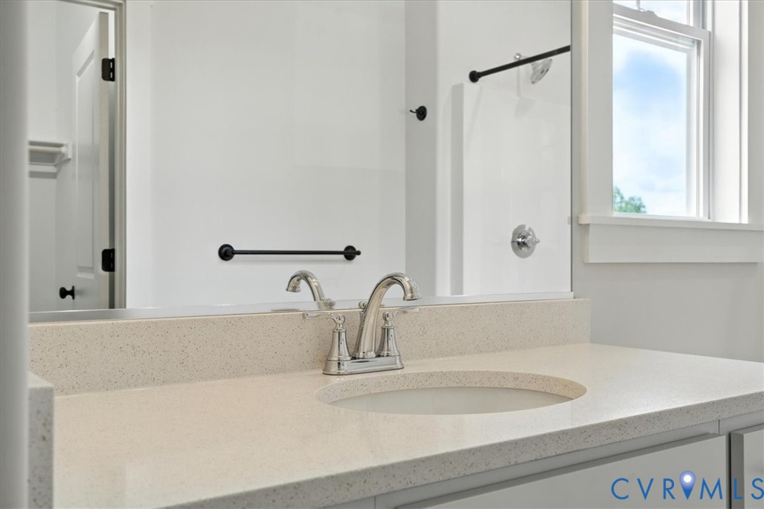 8666 Hat Creek Road Brookneal, VA 24528 - Photo 37 of 38 a bathroom with a sink and a mirror