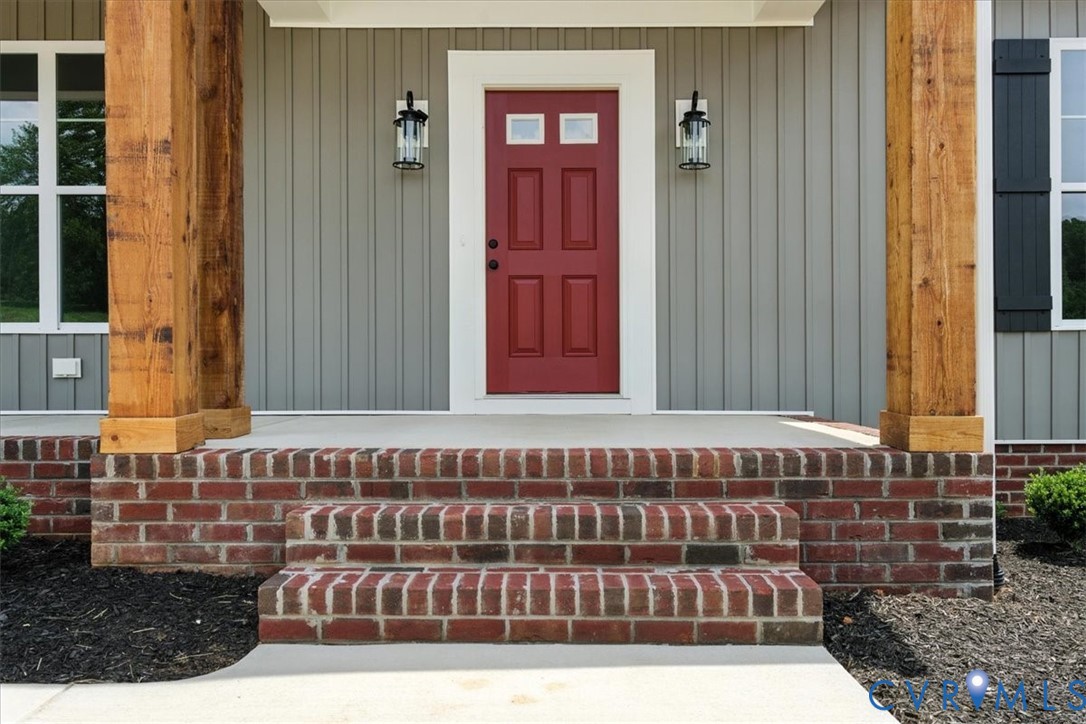 8666 Hat Creek Road Brookneal, VA 24528 - Photo 6 of 38 a view of a wooden door and a yard