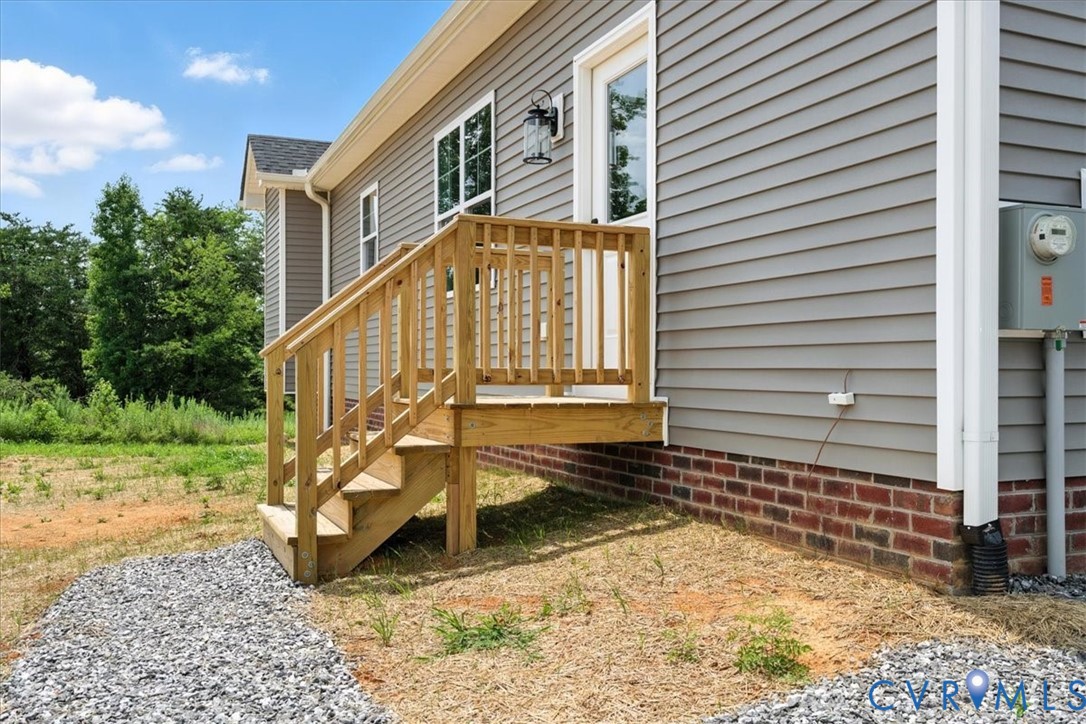 8666 Hat Creek Road Brookneal, VA 24528 - Photo 9 of 38 a view of a house with a yard