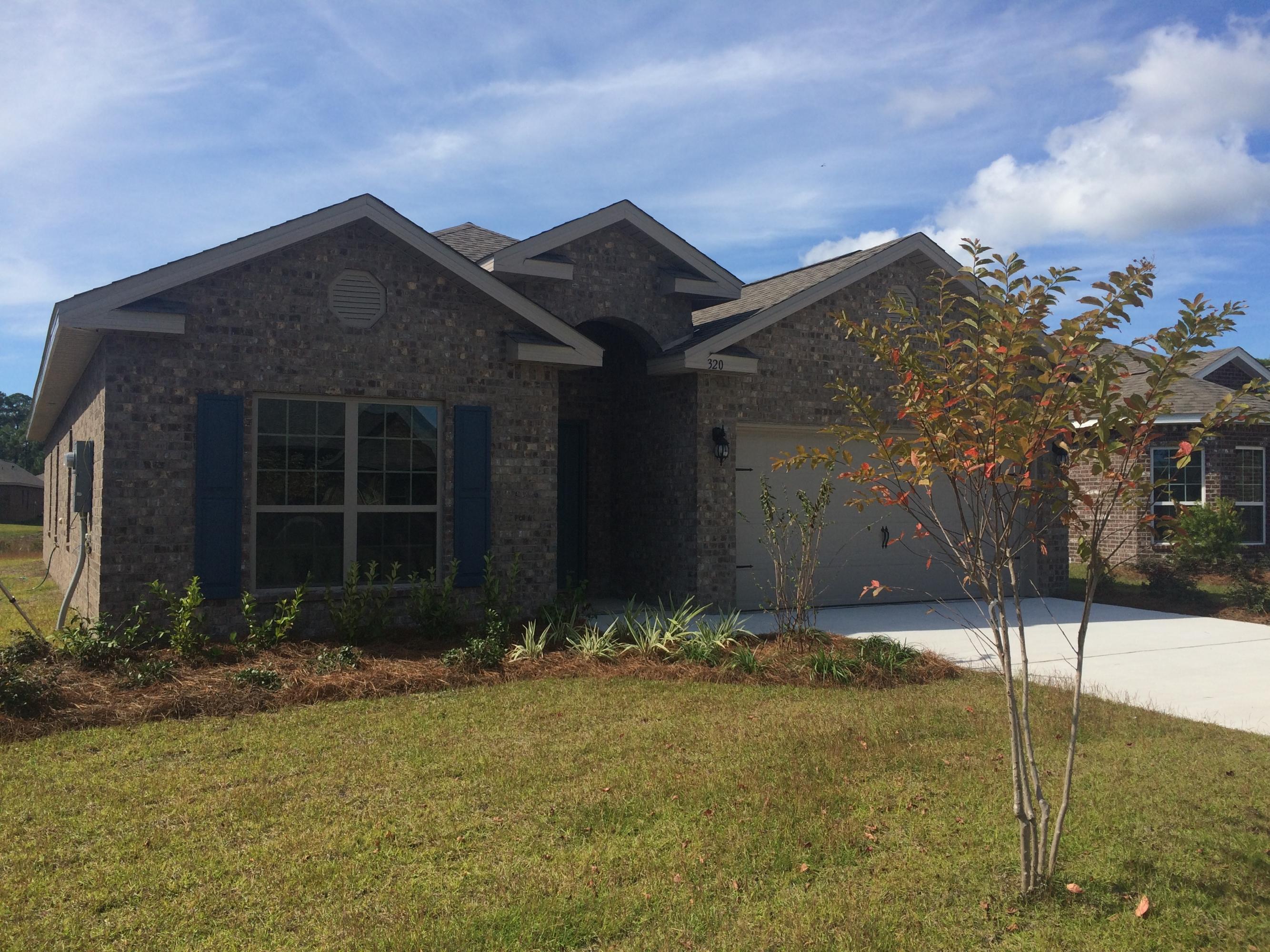 389 Pin Oak Loop Santa Rosa Beach, FL 32459 - Photo 1 of 19 a view of house with yard