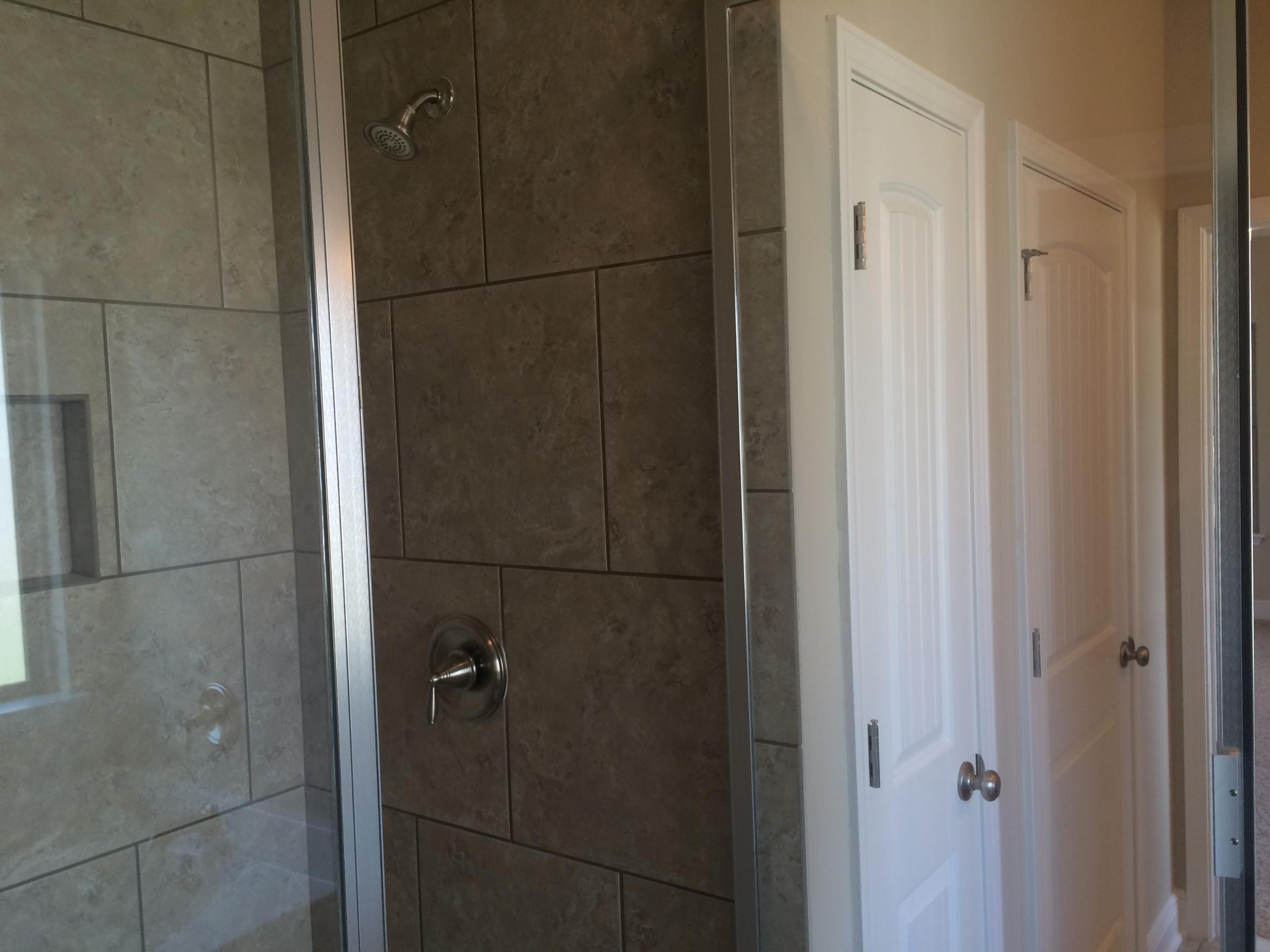 389 Pin Oak Loop Santa Rosa Beach, FL 32459 - Photo 14 of 19 a bathroom with a glass shower door