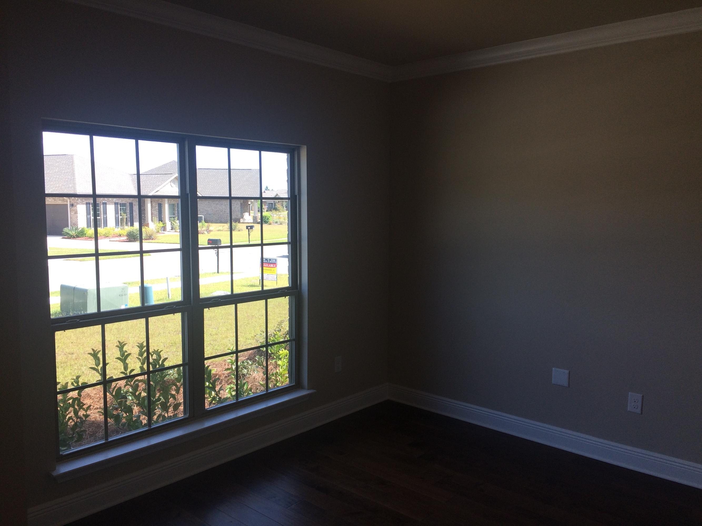 389 Pin Oak Loop Santa Rosa Beach, FL 32459 - Photo 6 of 19 a view of an empty room with a window