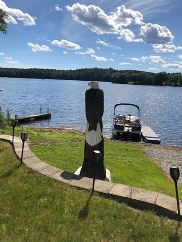 a view of a lake with a yard
