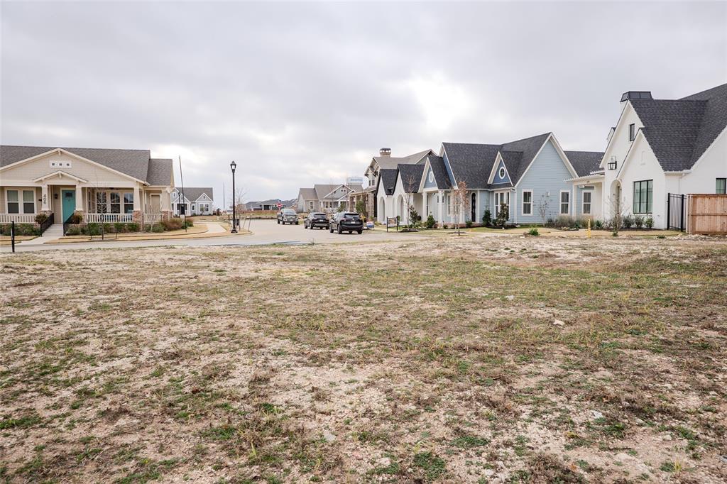 405 Garrett Way Midlothian, TX 76065 - Photo 9 of 26 a big house with a big yard and large trees