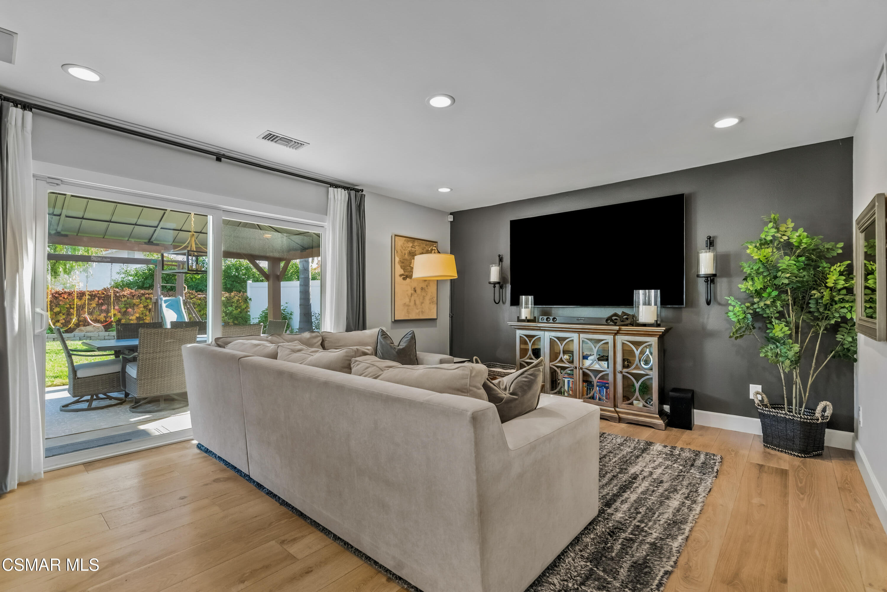 584 Fresh Meadows Road Simi Valley, CA 93065 - Photo 14 of 29 a living room with furniture and a flat screen tv