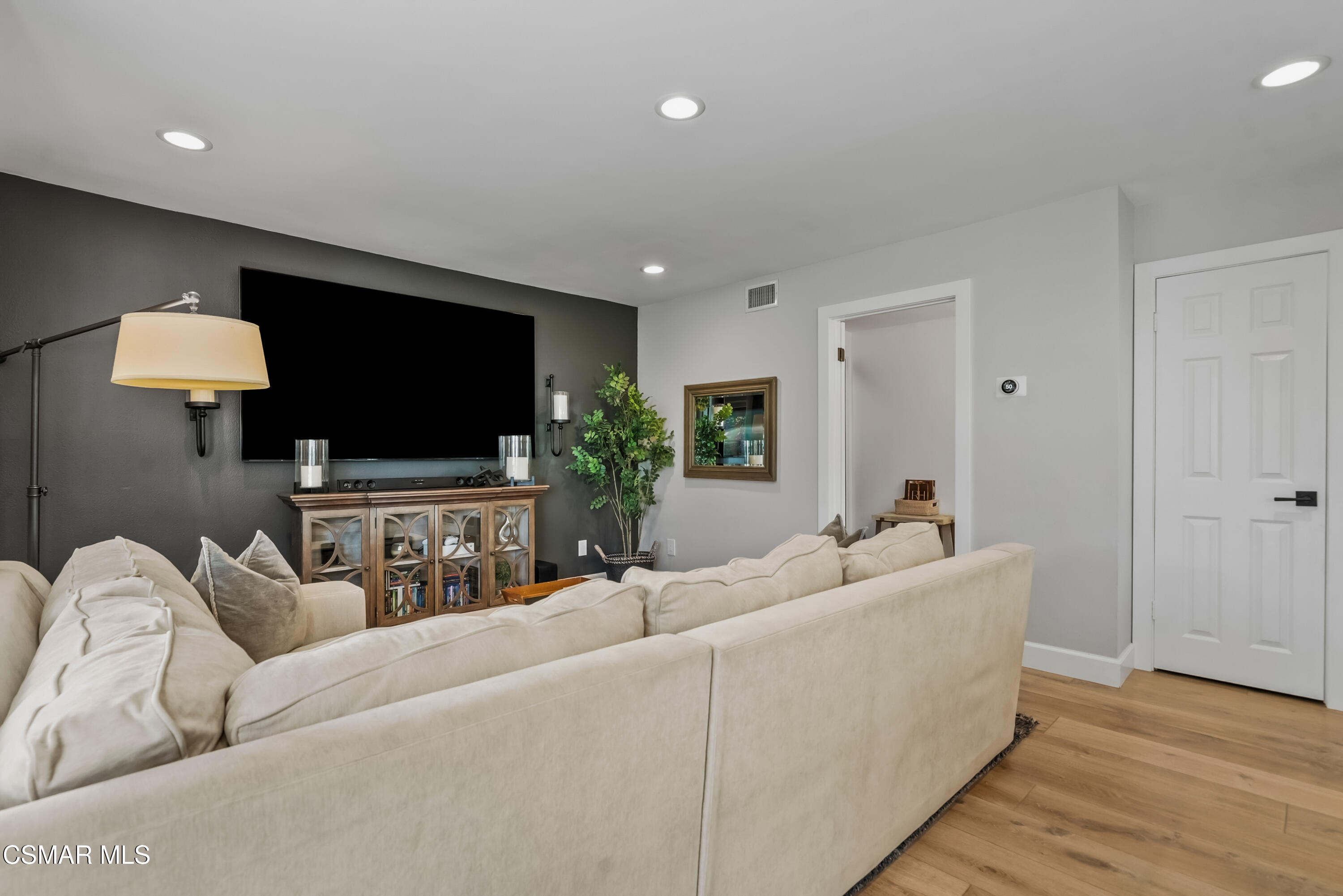584 Fresh Meadows Road Simi Valley, CA 93065 - Photo 16 of 29 a living room with furniture and a flat screen tv