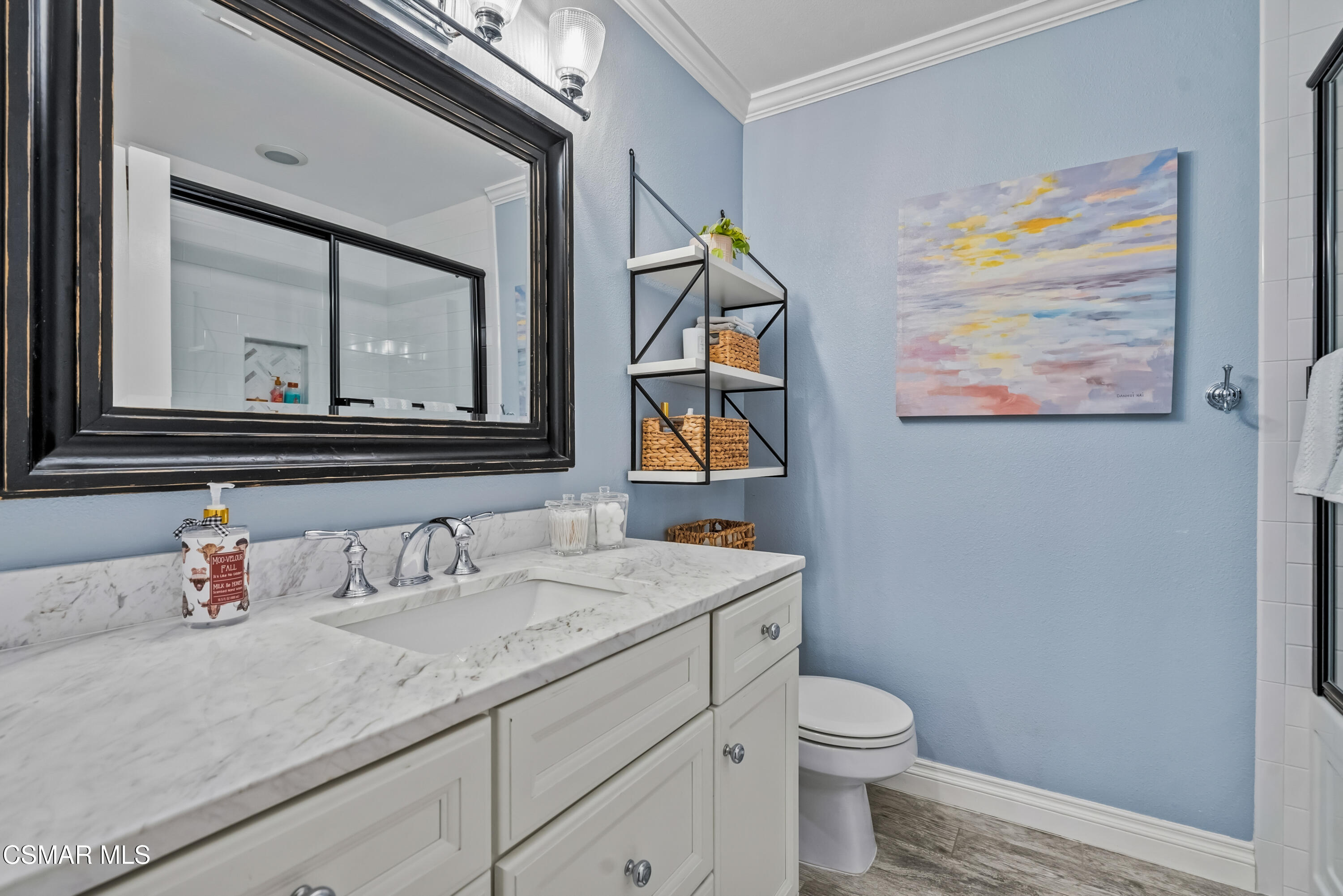 584 Fresh Meadows Road Simi Valley, CA 93065 - Photo 17 of 29 a bathroom with a toilet a sink and mirror