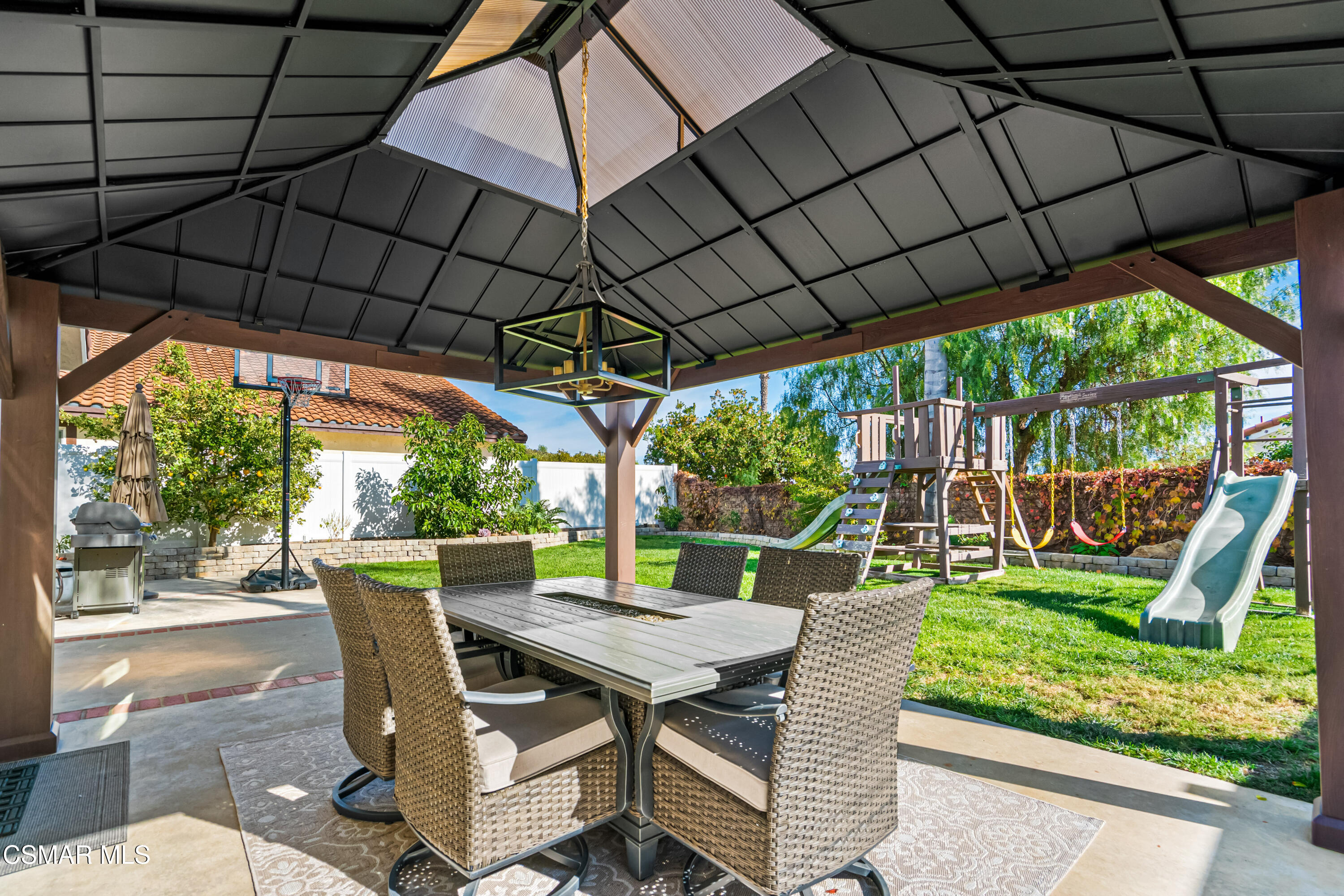 584 Fresh Meadows Road Simi Valley, CA 93065 - Photo 27 of 29 a view of patio with table and chairs under an umbrella