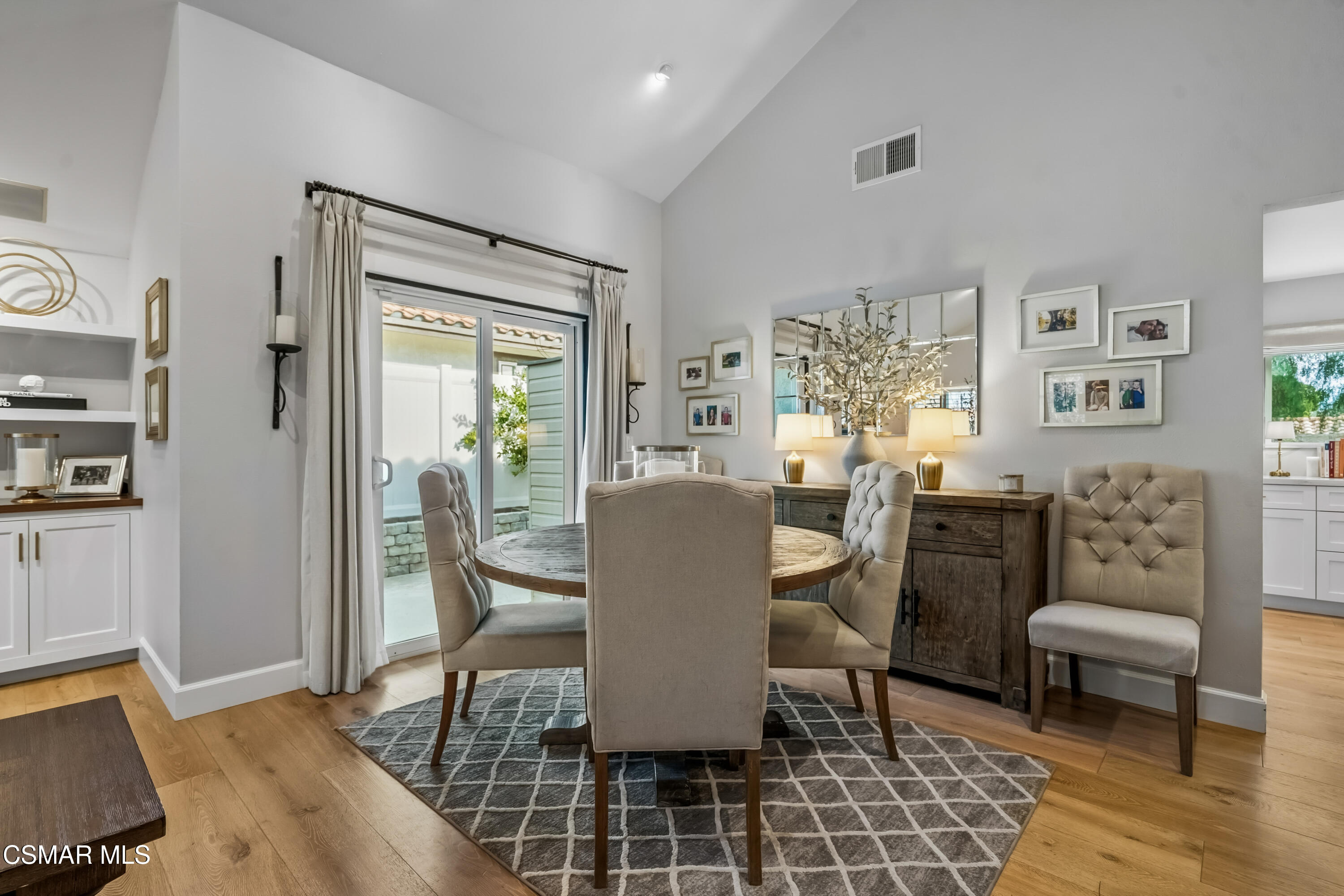 584 Fresh Meadows Road Simi Valley, CA 93065 - Photo 10 of 29 a dining room with furniture a rug and wooden floor