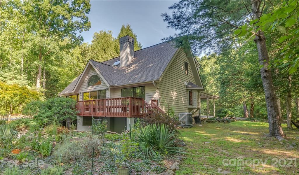 127 Pink Campbell Road, Unit 3B Landrum, SC 29356 - Photo 1 of 46 a view of a house with a yard and plants