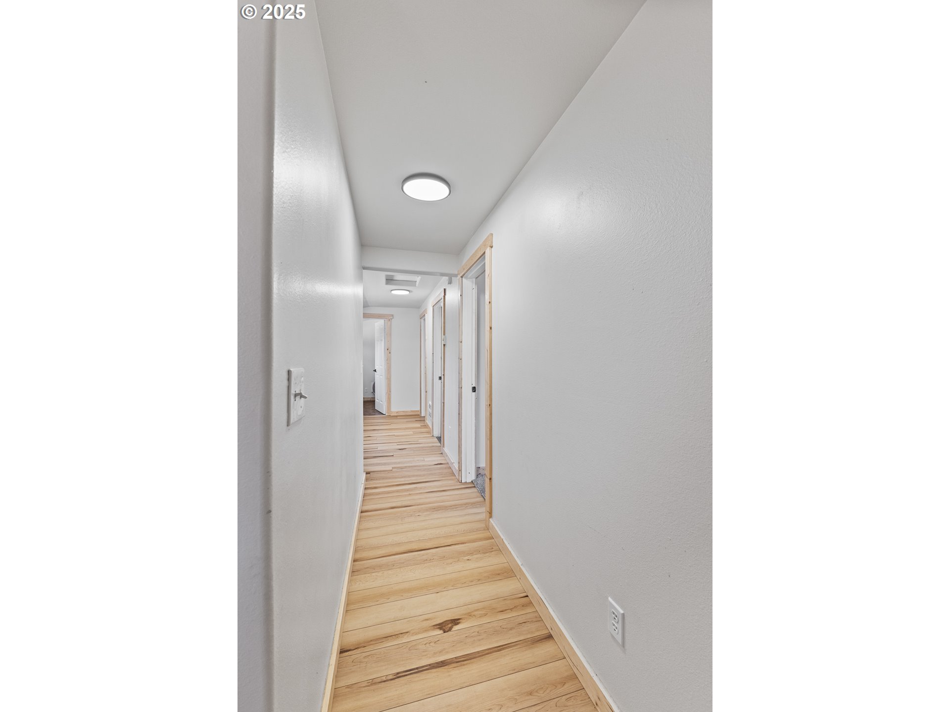 765 State Street North Bend, OR 97459 - Photo 17 of 46 a view of a hallway with wooden floor