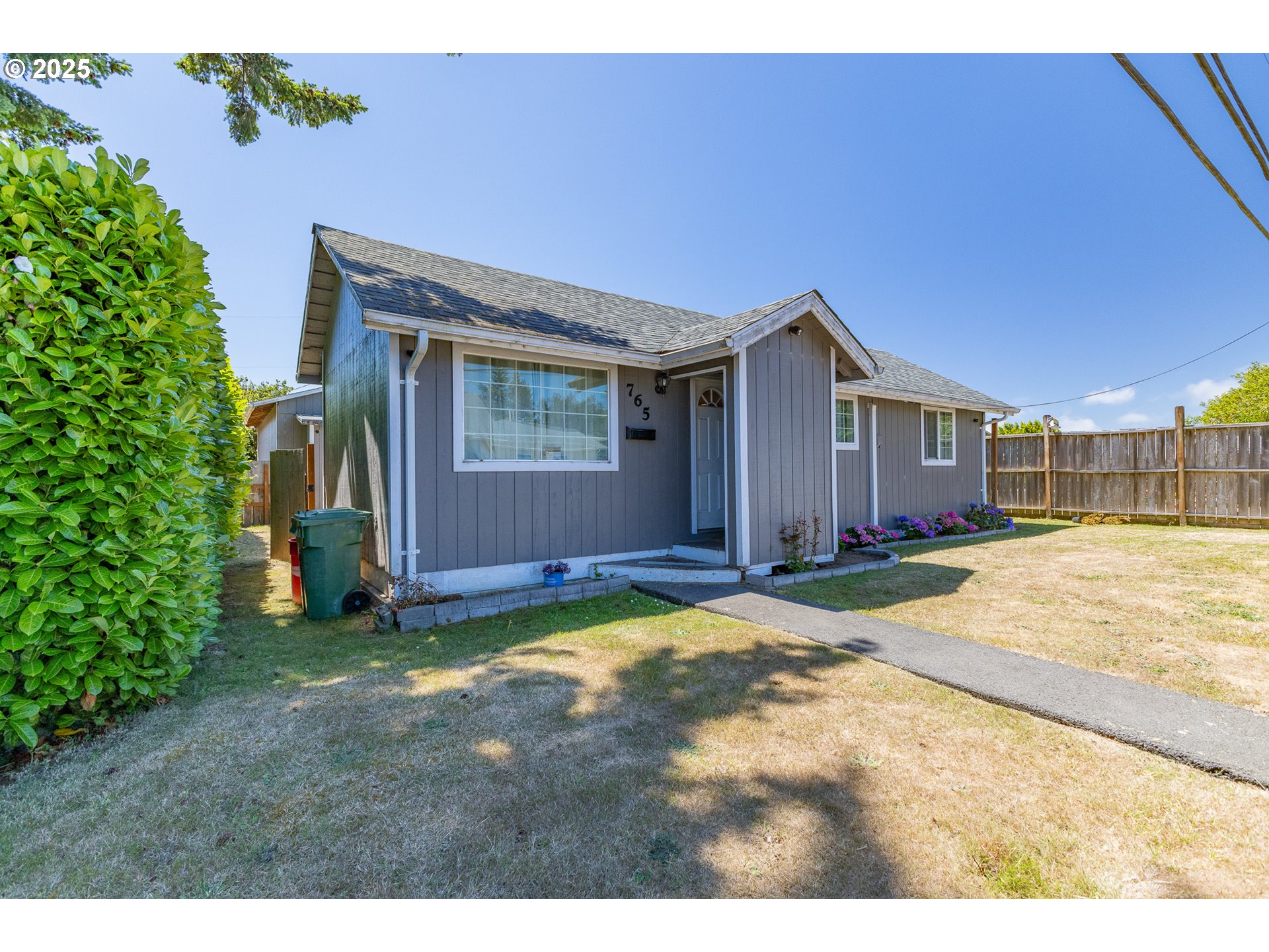 765 State Street North Bend, OR 97459 - Photo 2 of 46 a view of a house with basketball court
