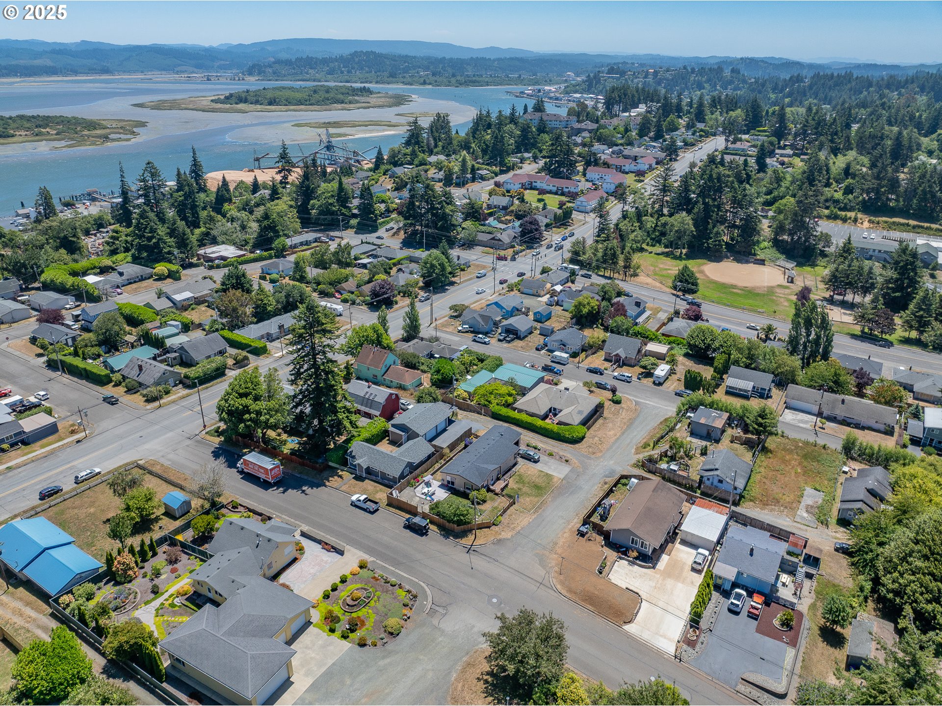 765 State Street North Bend, OR 97459 - Photo 38 of 46 an aerial view of residential houses with outdoor space