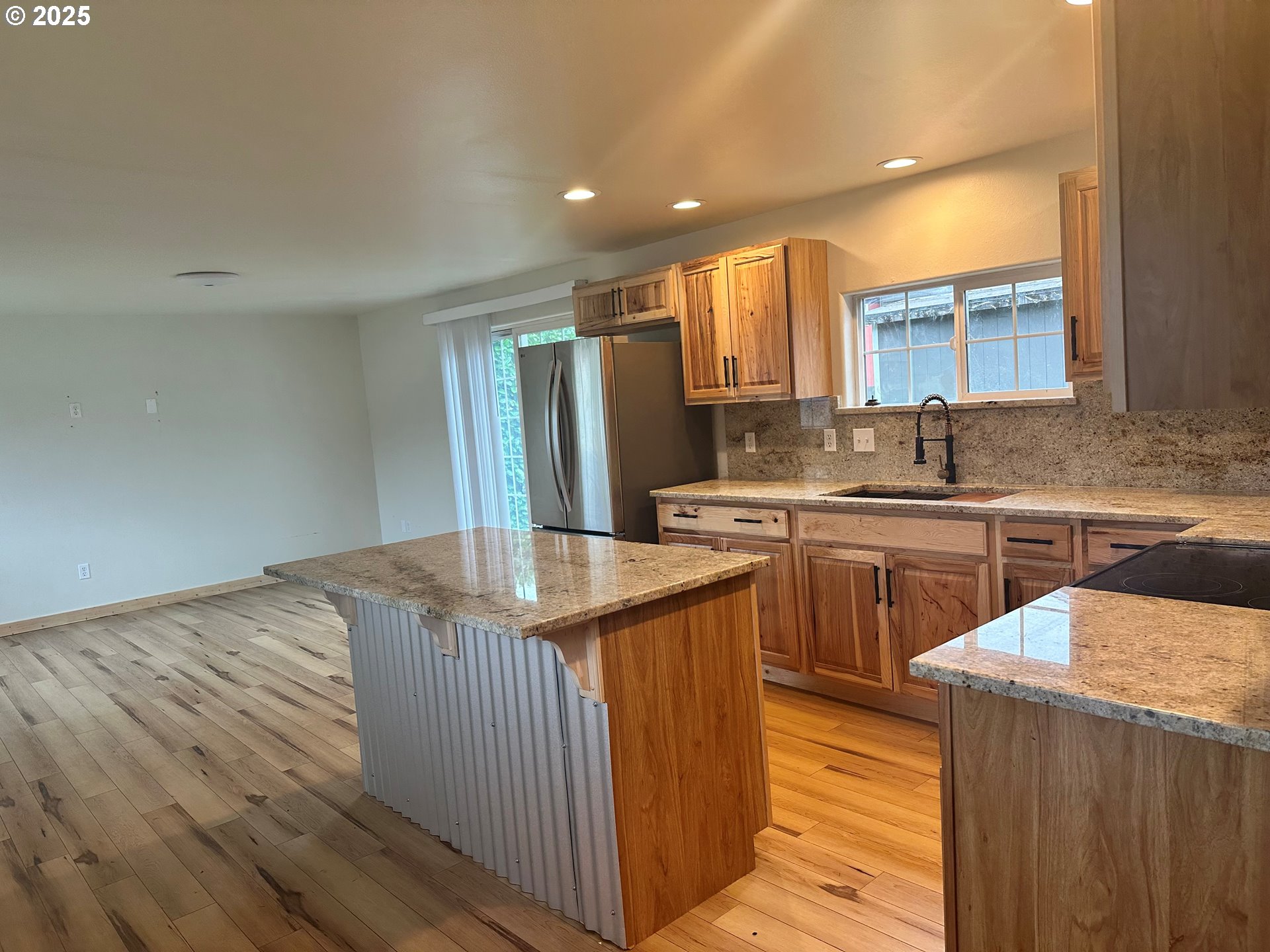 765 State Street North Bend, OR 97459 - Photo 44 of 46 a kitchen with stainless steel appliances granite countertop a sink stove and refrigerator
