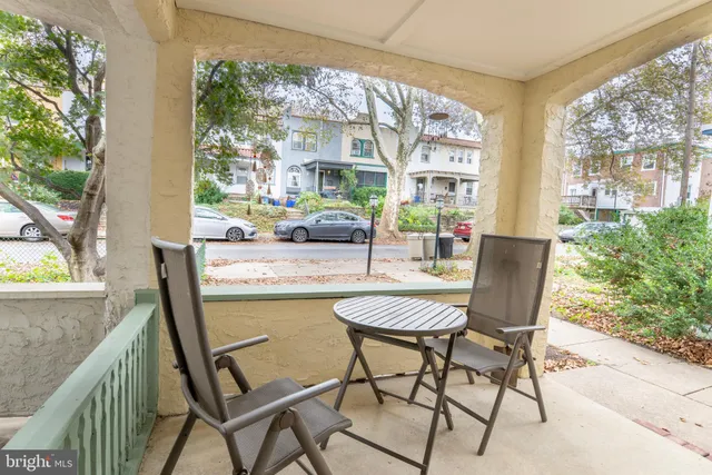 a dining room with furniture and a window