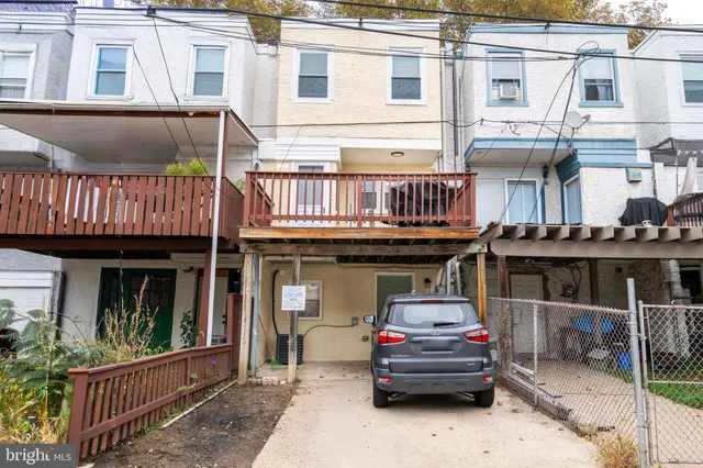 a car parked in front of a house