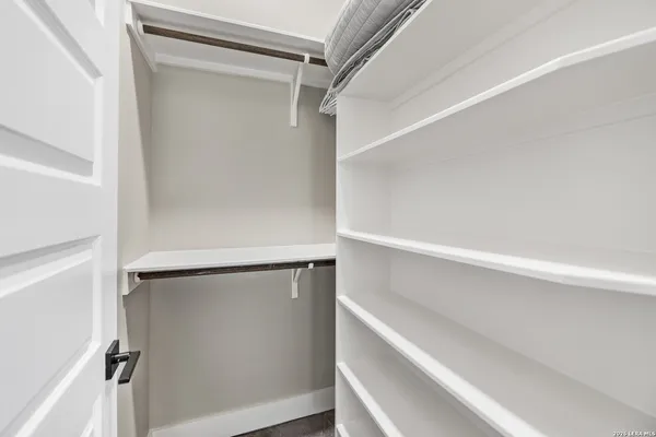 a view of an empty walk in closet