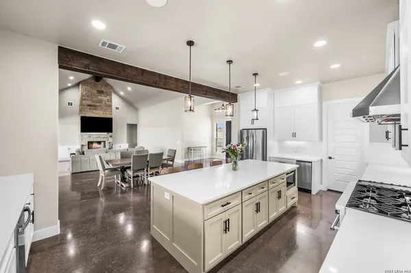 a large white kitchen with lots of counter space