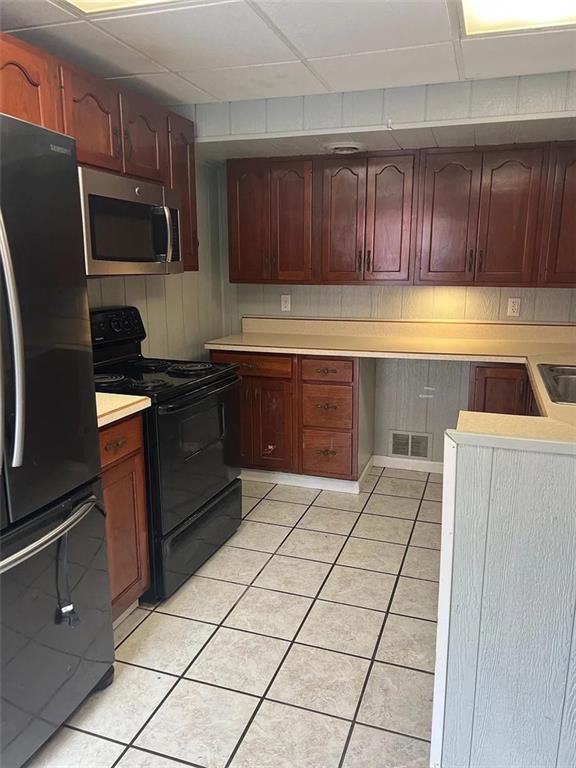 2 Mallard Street Allenport, PA 15412 - Photo 8 of 25 a kitchen with stainless steel appliances granite countertop a refrigerator and a stove top oven