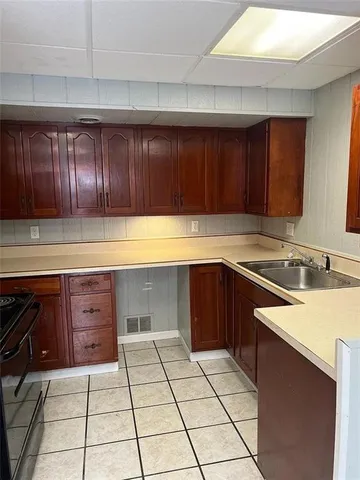 a kitchen with a sink and cabinets
