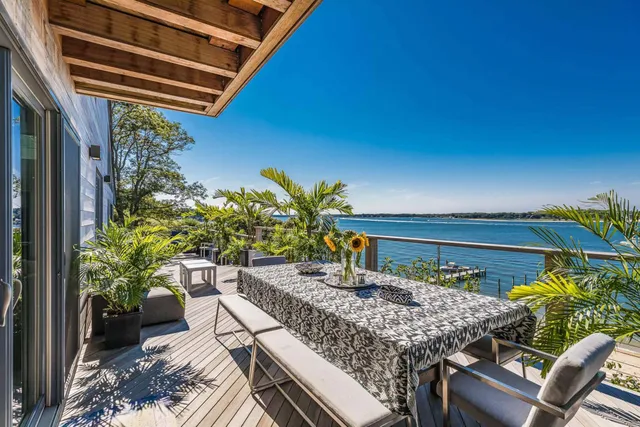 a view of a chairs and table in the patio