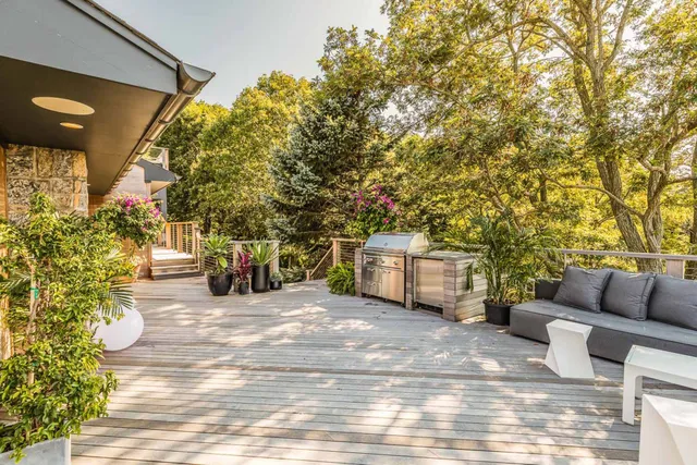 a balcony with furniture and garden