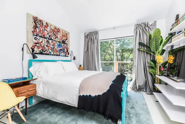 a view of a patio with table and chairs and wooden floor