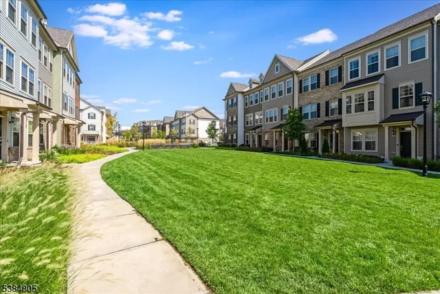 a view of a building with a yard