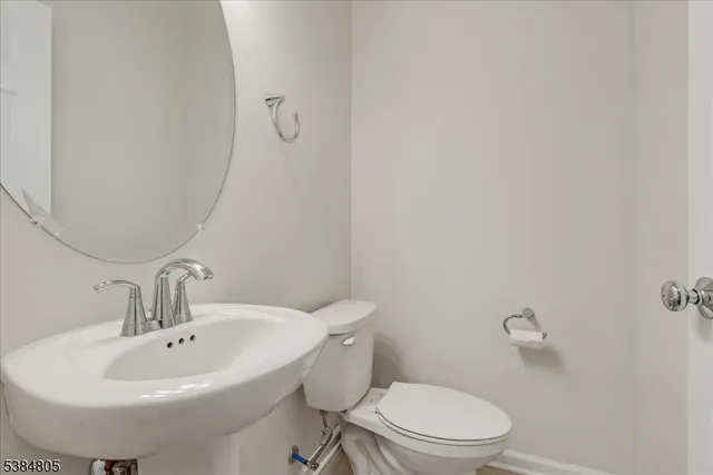 a white sink sitting next to a white sink